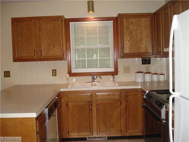 1105 Ridgecliff Drive Rural Hall, NC 27045 - Photo 7 of 14 Kitchen. REPLACEMENT WINDOWS THROUGHOUT