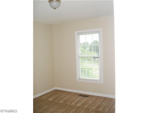 1105 Ridgecliff Drive Rural Hall, NC 27045 - Photo 10 of 14 2nd Bedroom. ENTIRE INTERIOR FRESHLY PAINTED IN NEUTRAL DECOR