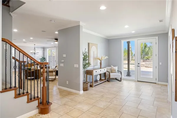 a view of entryway with stairs and a window