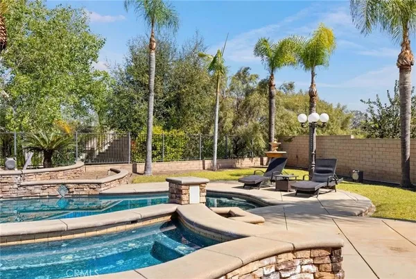a view of a swimming pool with a lounge chairs