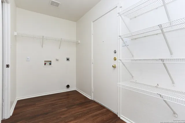 a view of an empty walk in closet