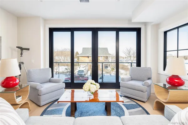 a living room with furniture and a large window