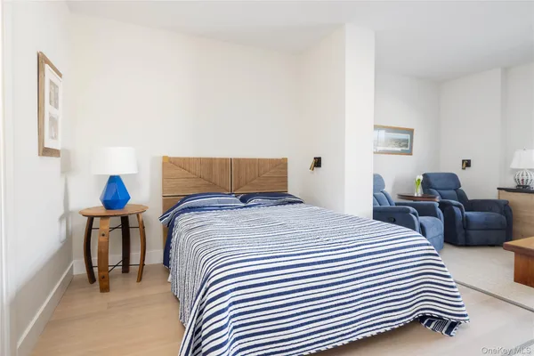 a bedroom with bed and a couch