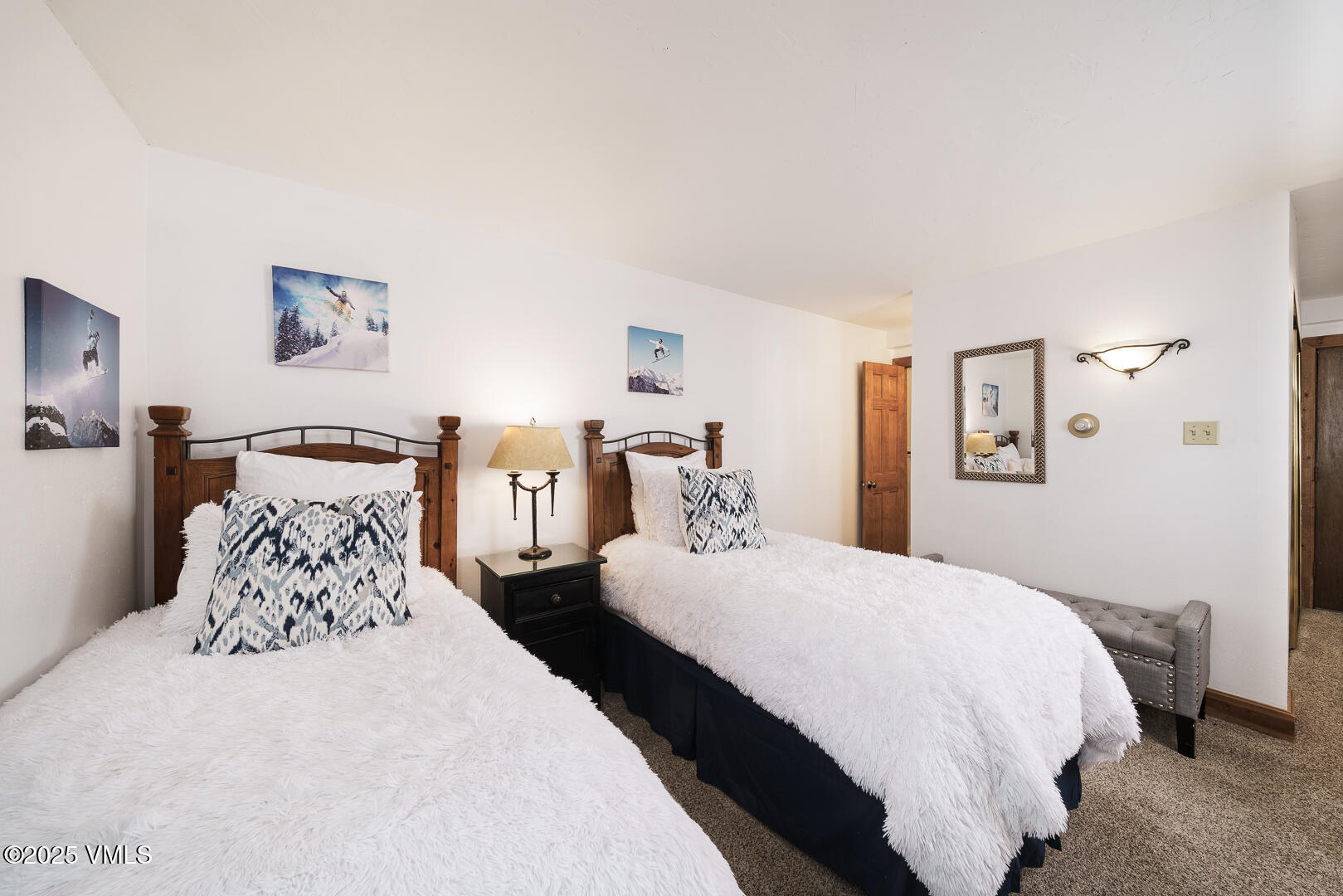 548 South Frontage Road West, Unit 301 Vail, CO 81657 - Photo 14 of 32 a bedroom with double bed and a lamp