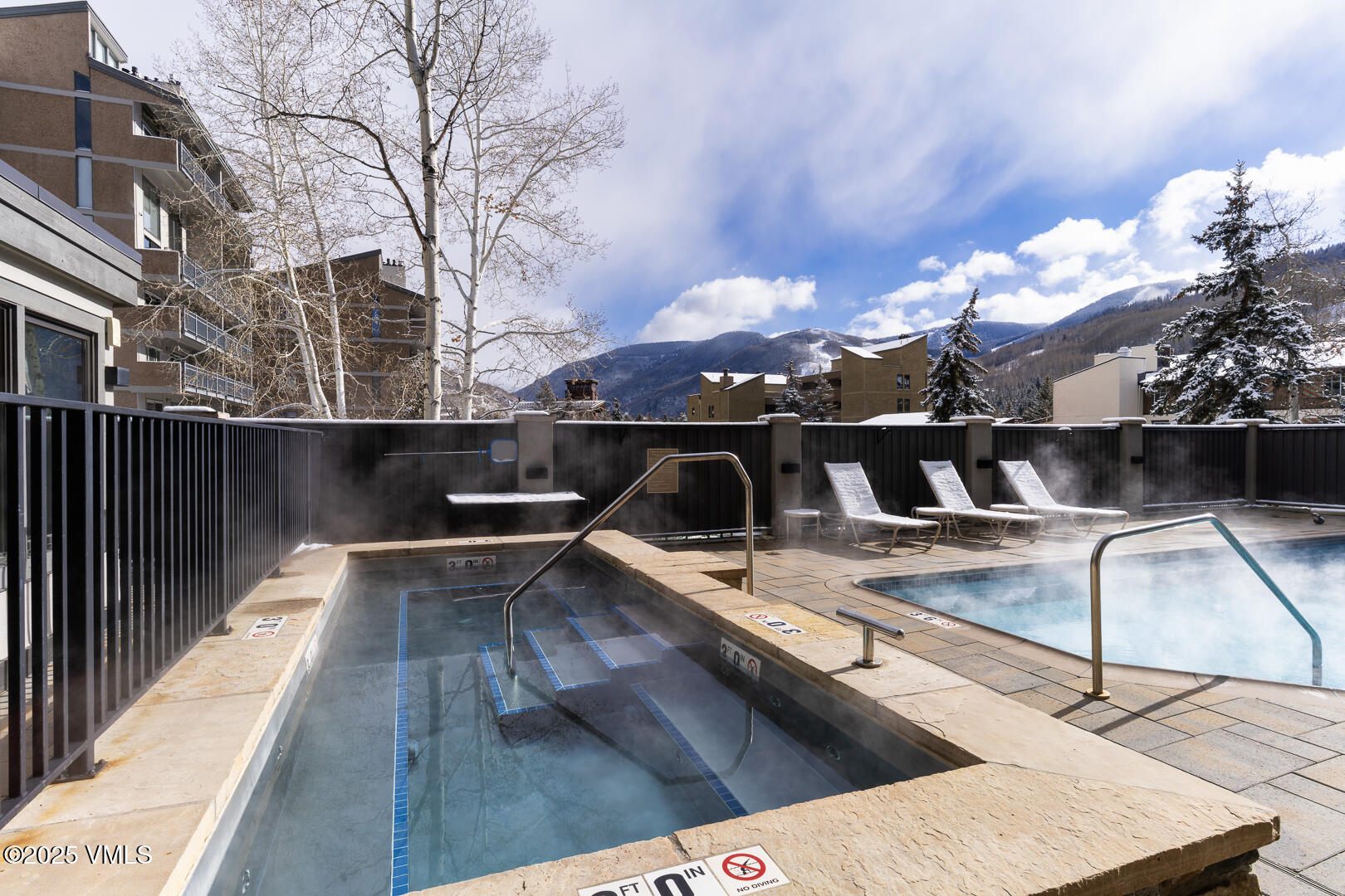 548 South Frontage Road West, Unit 301 Vail, CO 81657 - Photo 22 of 32 a view of a balcony with two couches and wooden floor
