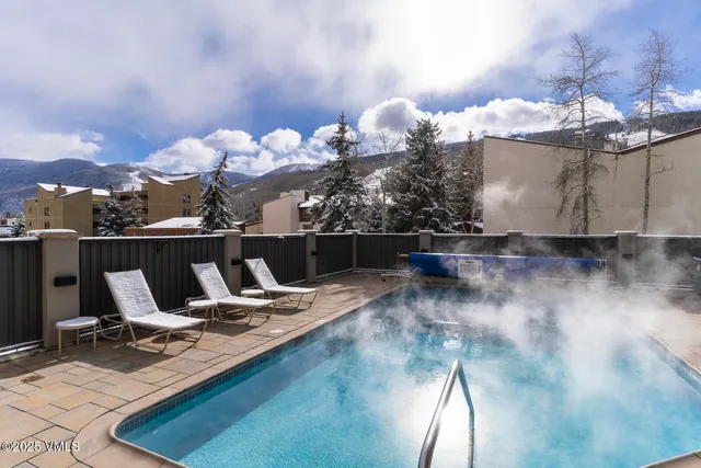 a view of a workspace with furniture