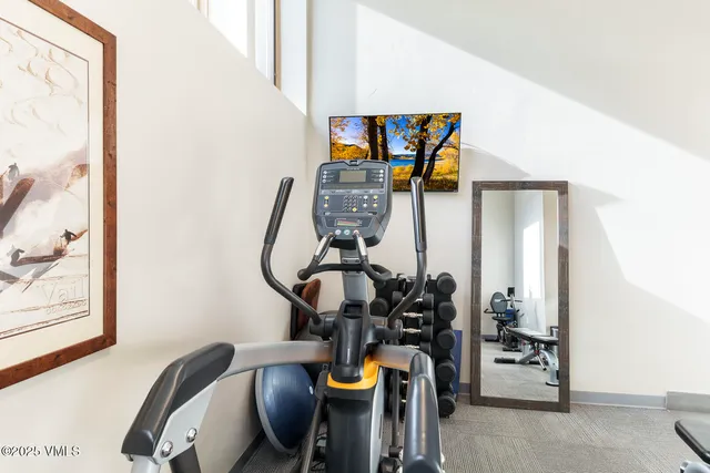 a view of living room with furniture and rug