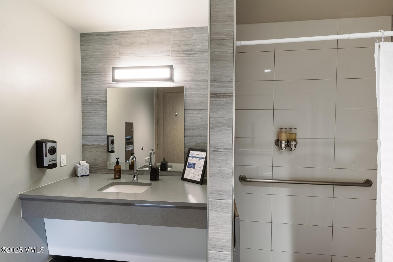 548 South Frontage Road West, Unit 301 Vail, CO 81657 - Photo 27 of 32 a bathroom with a sink and a mirror