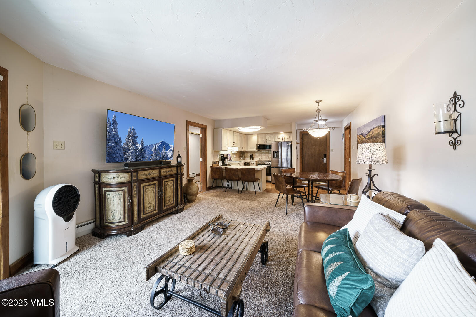 548 South Frontage Road West, Unit 301 Vail, CO 81657 - Photo 6 of 32 a living room with furniture lamp and window