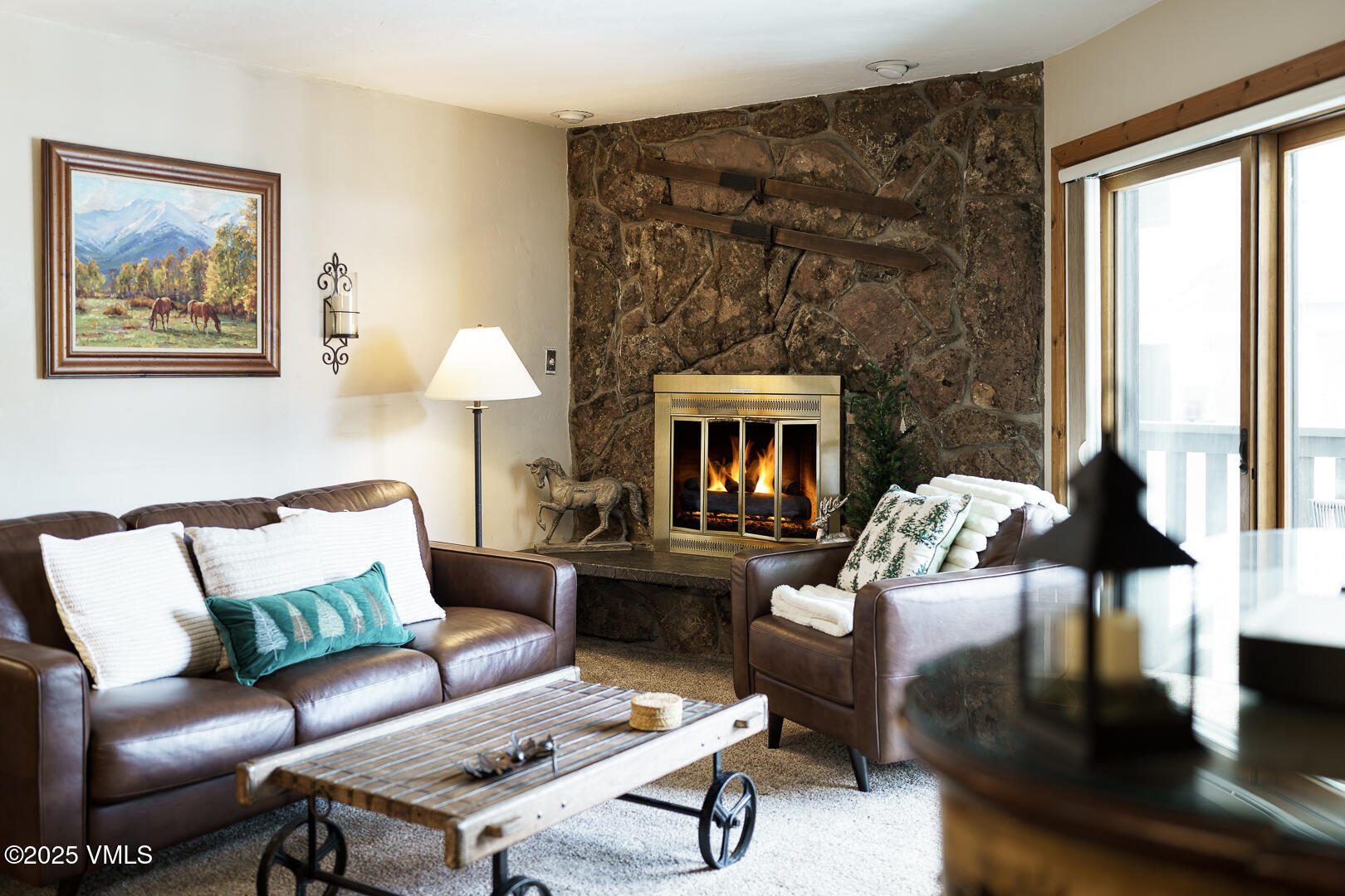 548 South Frontage Road West, Unit 301 Vail, CO 81657 - Photo 7 of 32 a living room with furniture and a fireplace