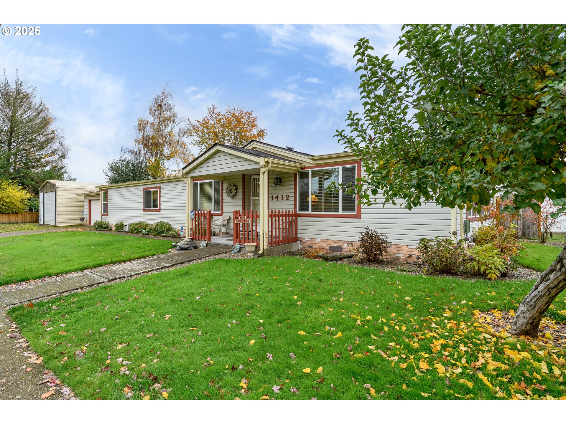 a front view of a house with a garden