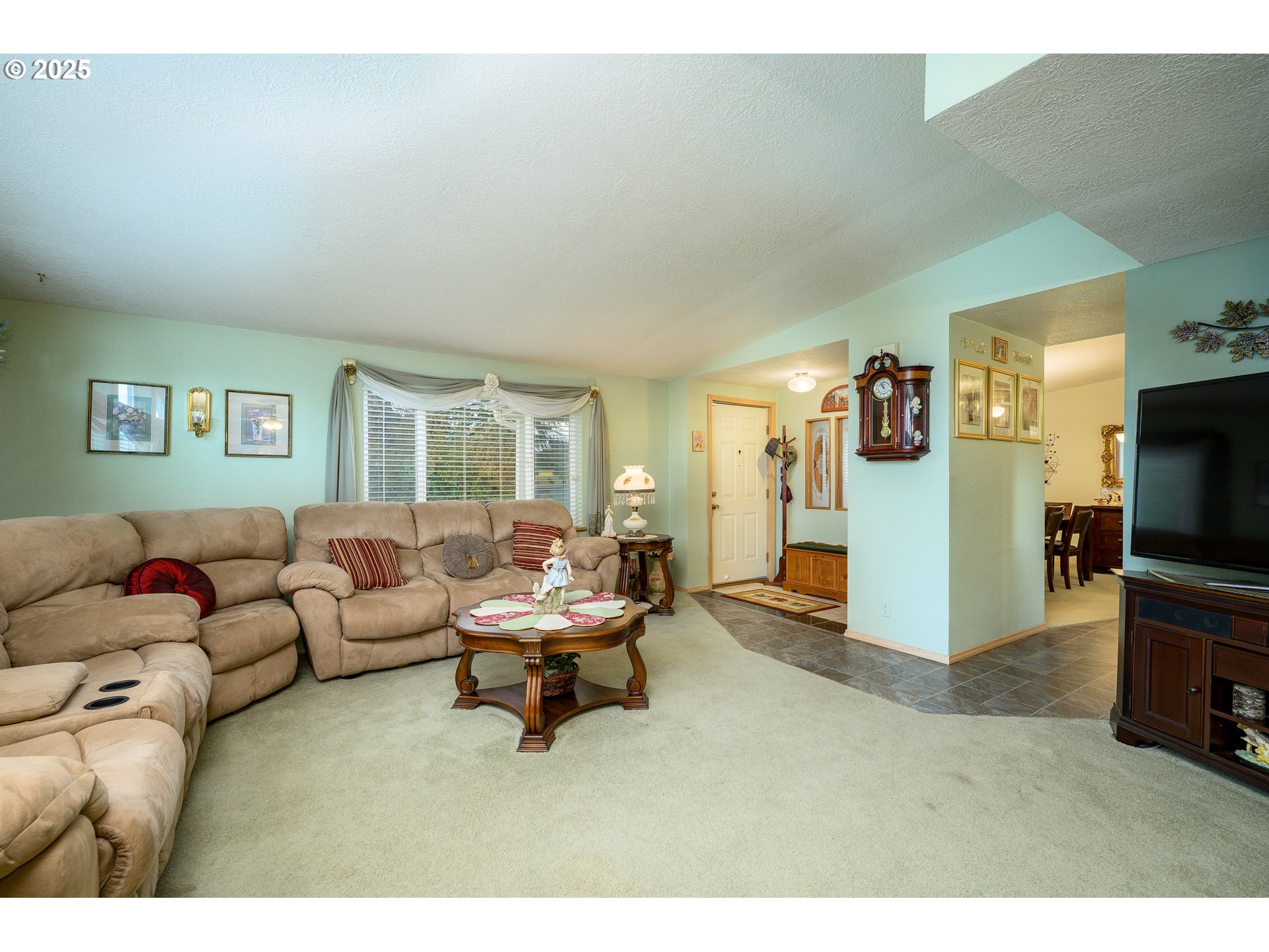 1412 Northwest Wallace Road McMinnville, OR 97128 - Photo 16 of 44 a living room with furniture and a flat screen tv