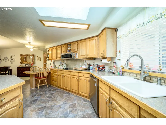 a kitchen with lots of counter top space and appliances
