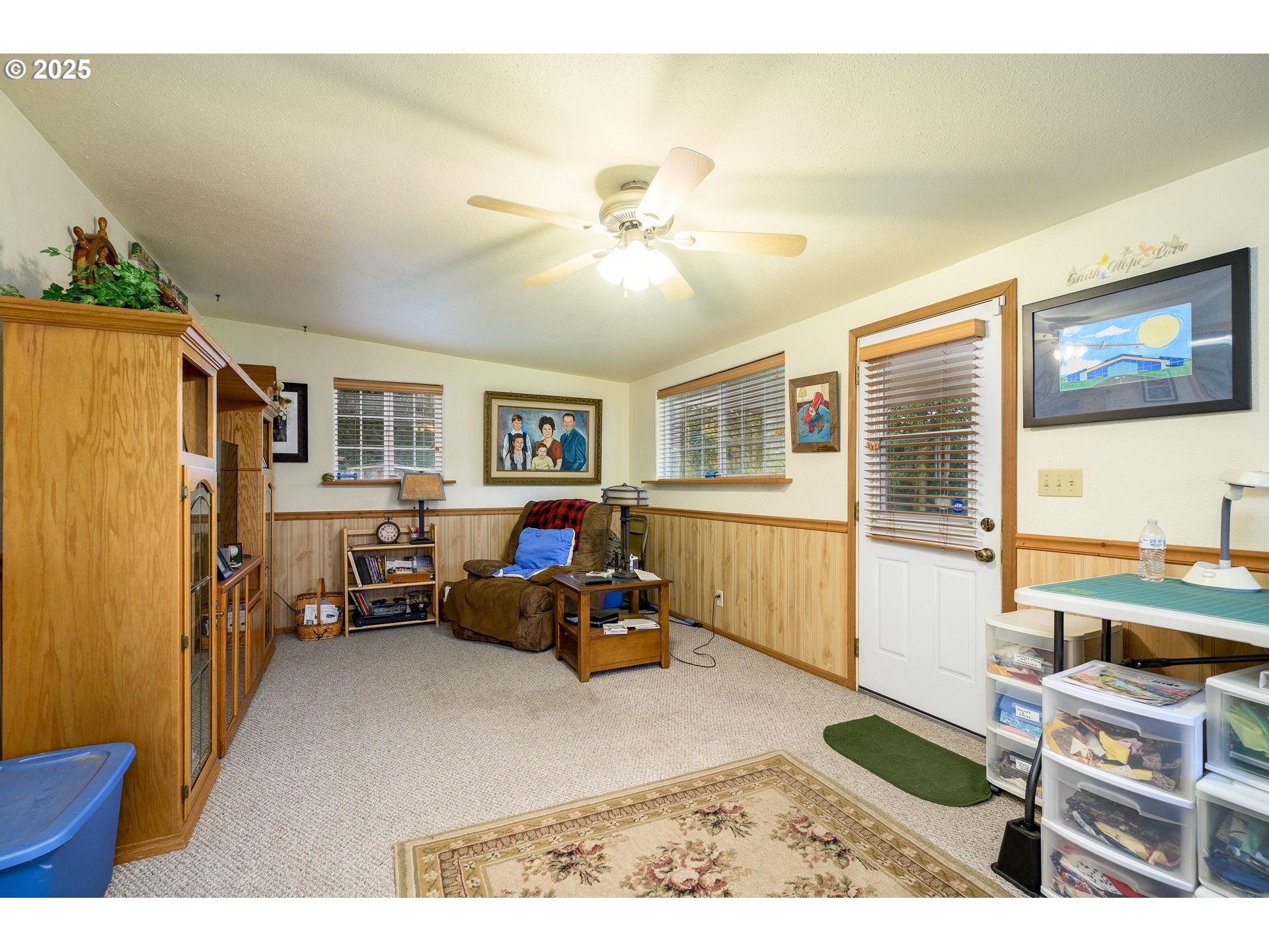 1412 Northwest Wallace Road McMinnville, OR 97128 - Photo 26 of 44 a living room with furniture and a window