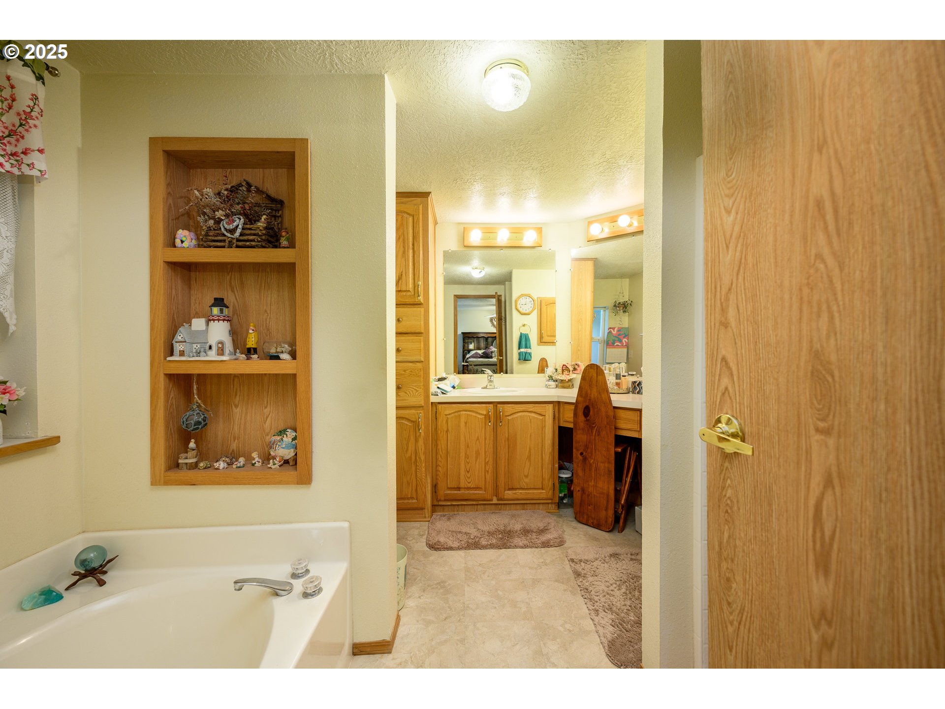 1412 Northwest Wallace Road McMinnville, OR 97128 - Photo 31 of 44 a bathroom with a sink and a mirror