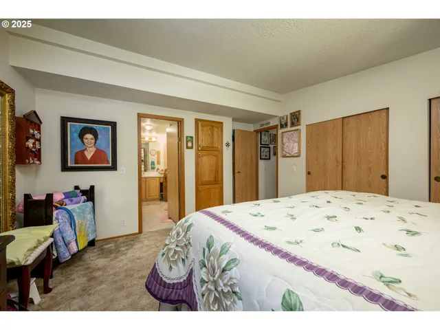 a bathroom with a sink mirror and a bath