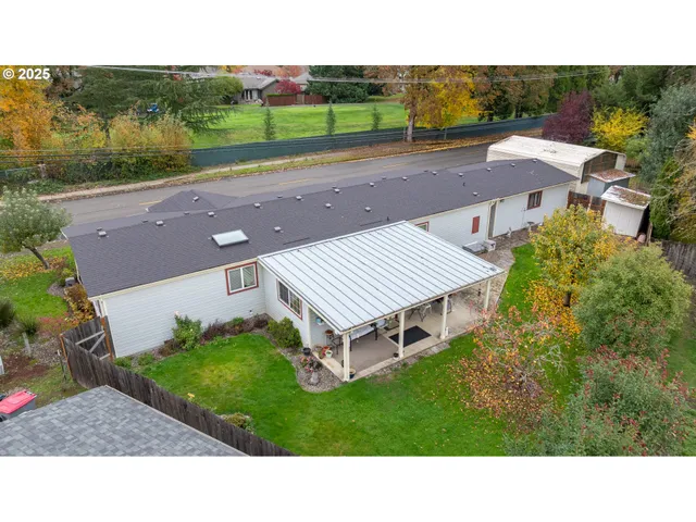 a aerial view of a house with a yard