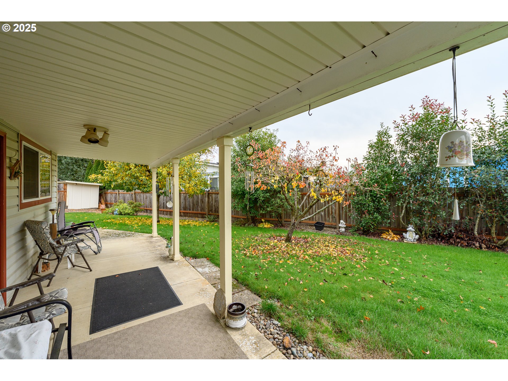 1412 Northwest Wallace Road McMinnville, OR 97128 - Photo 42 of 44 a view of a patio with table and chairs next to a yard