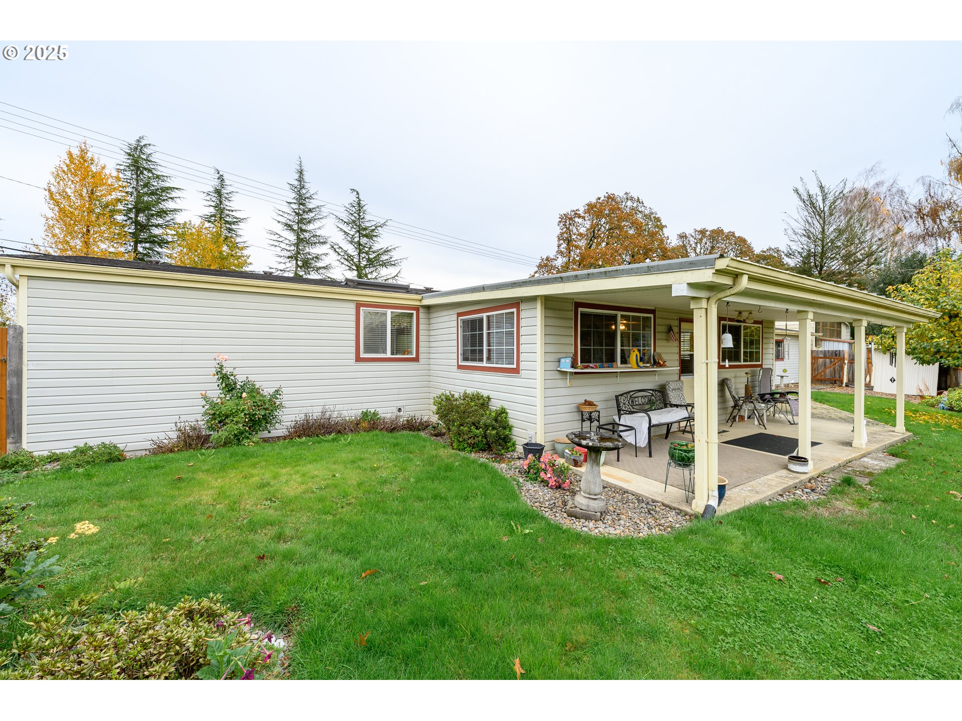 1412 Northwest Wallace Road McMinnville, OR 97128 - Photo 44 of 44 a view of a house with backyard sitting area and garden
