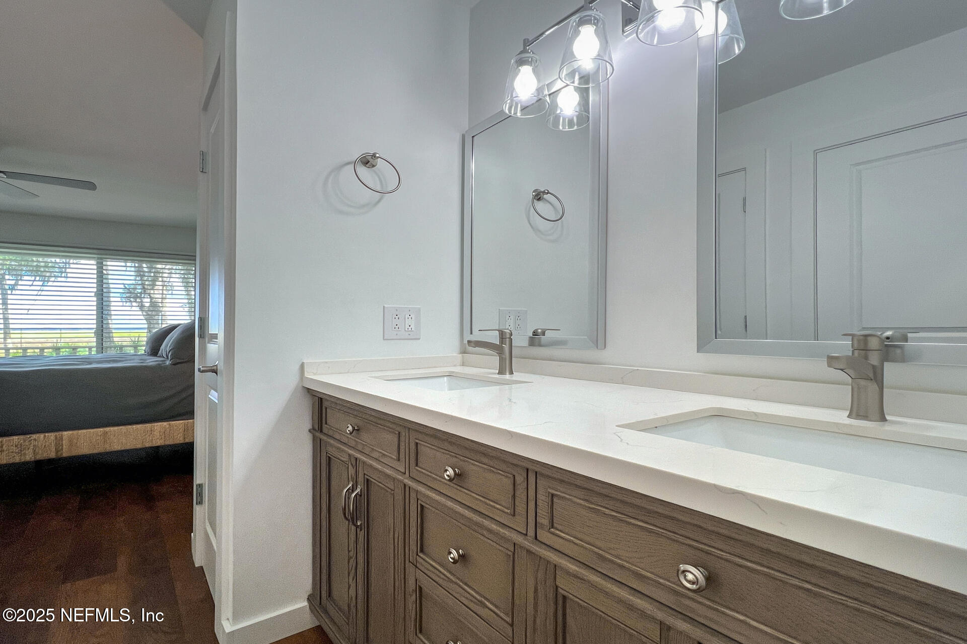 3426 Sea Marsh Road Fernandina Beach, FL 32034 - Photo 20 of 39 a en suite bathroom with a sink and a mirror