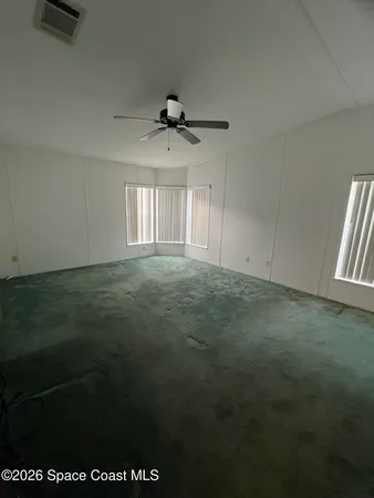 a view of an empty room and window