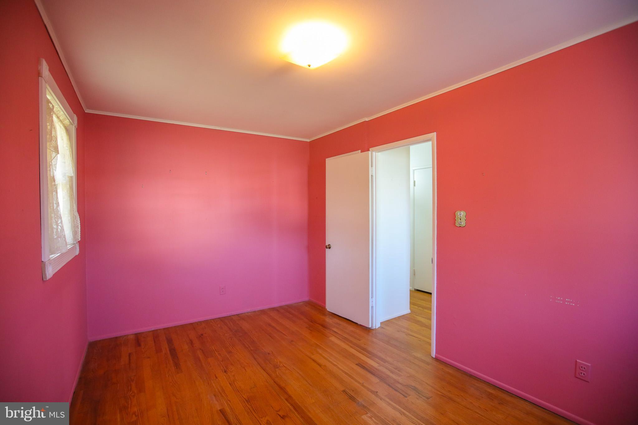 8815 Jandell Road Lorton, VA 22079 - Photo 14 of 27 a view of empty room with wooden floor and fan