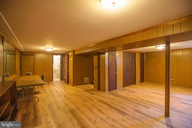 a spacious bedroom with a large bed and a shower