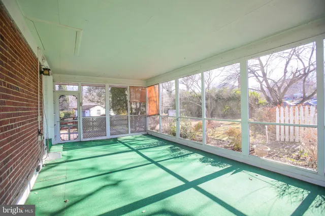 a room with a large window and yard