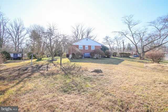 a view of swimming pool with outdoor seating and yard