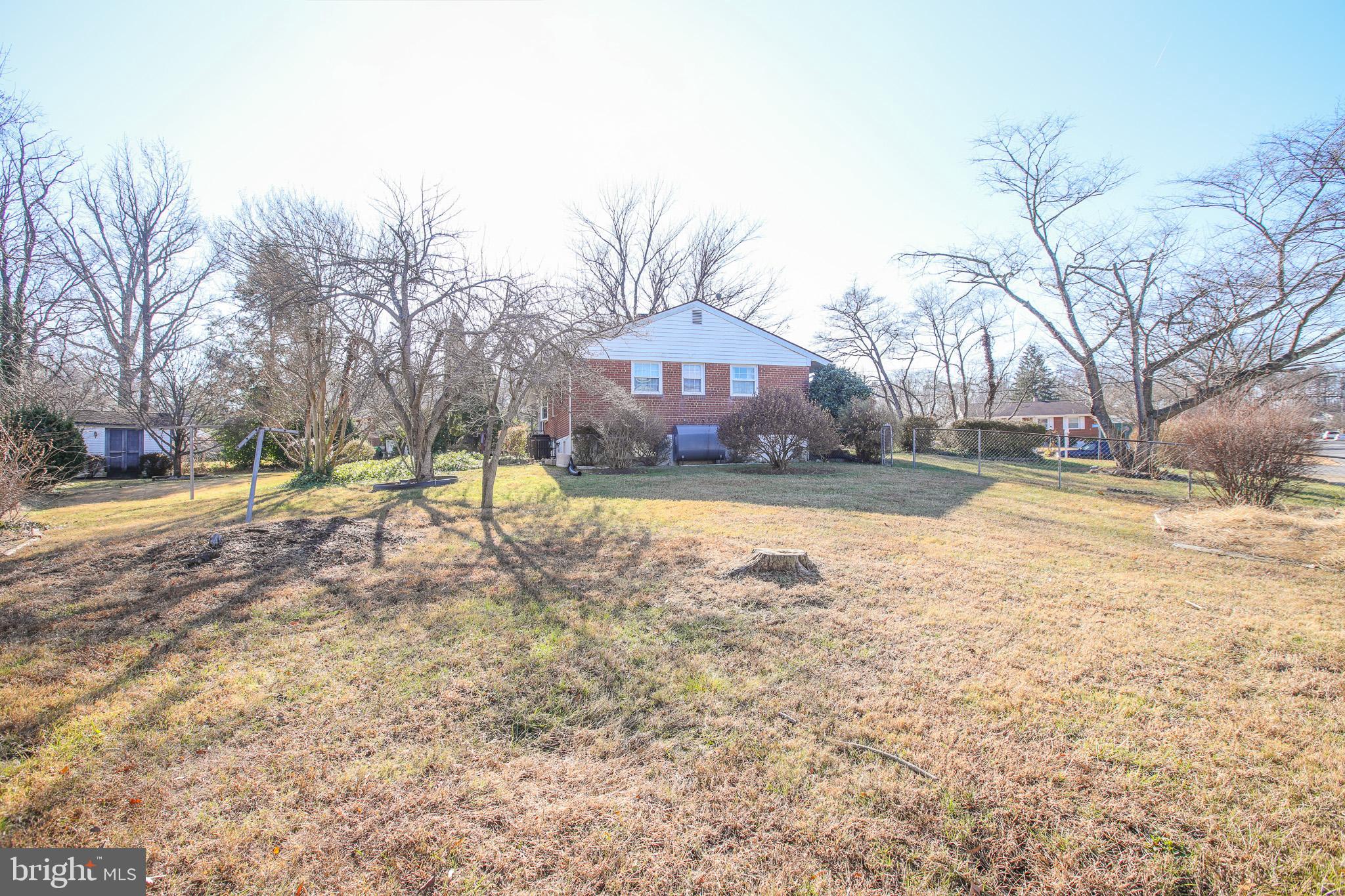 8815 Jandell Road Lorton, VA 22079 - Photo 25 of 27 a view of a yard with a house in the background