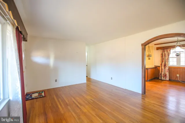 a view of a room with wooden floor