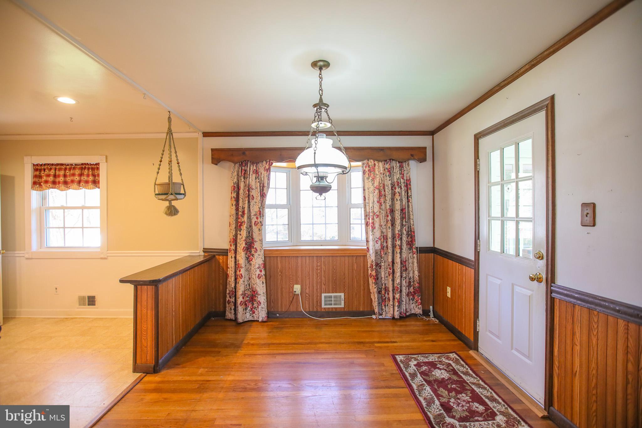 8815 Jandell Road Lorton, VA 22079 - Photo 7 of 27 a view of a room with wooden floor and windows