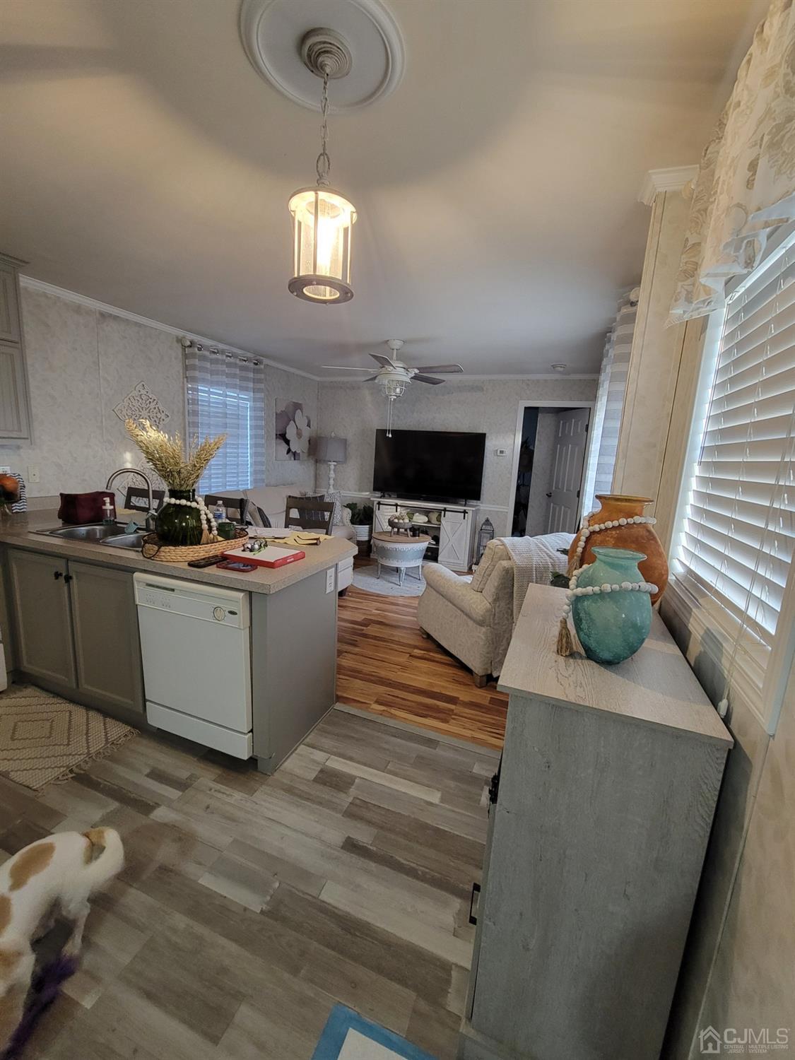 18 3rd Street Avenel, NJ 07001 - Photo 11 of 20 a living room with stainless steel appliances kitchen island granite countertop furniture and a fireplace