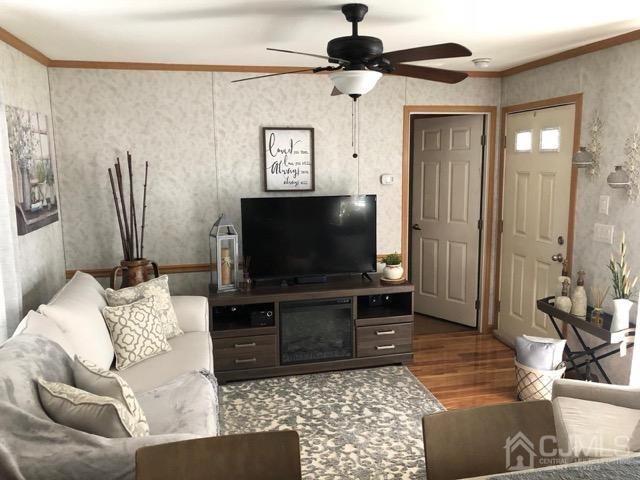 18 3rd Street Avenel, NJ 07001 - Photo 12 of 20 a living room with furniture and a flat screen tv