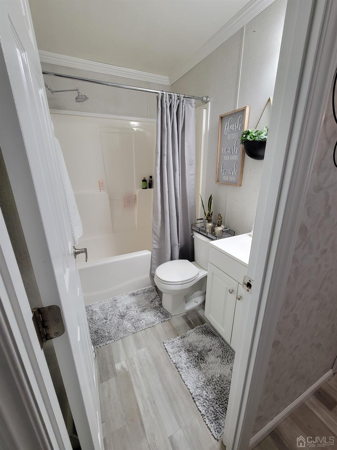 18 3rd Street Avenel, NJ 07001 - Photo 15 of 20 a bathroom with a sink toilet and shower