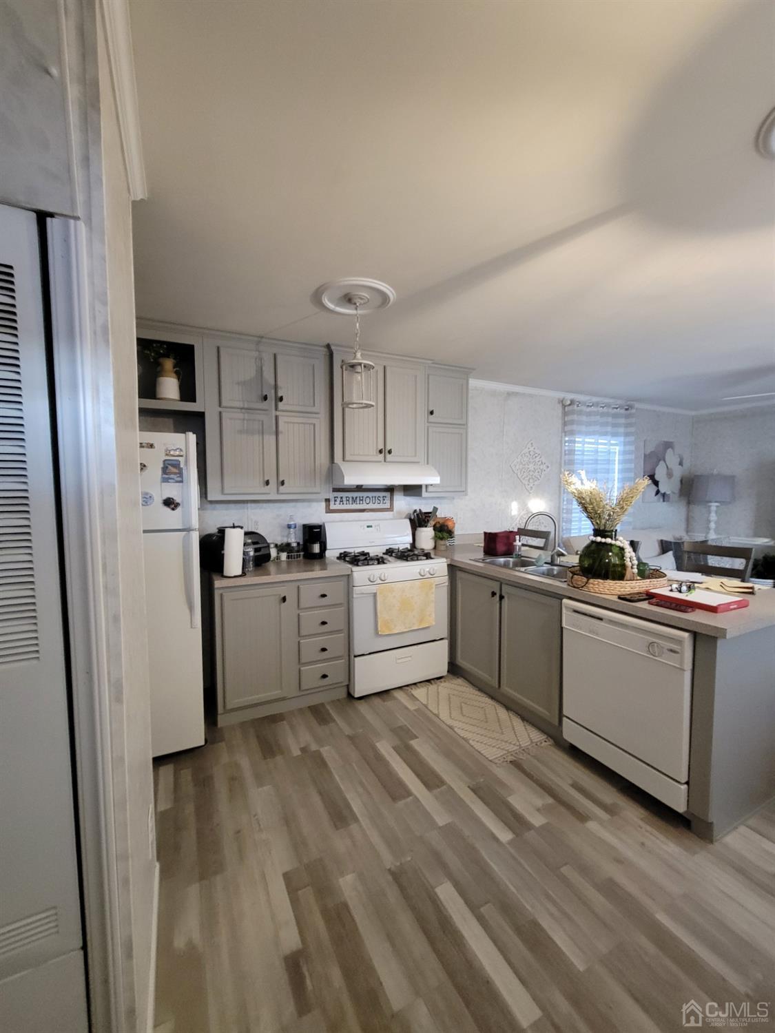 18 3rd Street Avenel, NJ 07001 - Photo 7 of 20 a kitchen with stainless steel appliances a refrigerator sink and cabinets