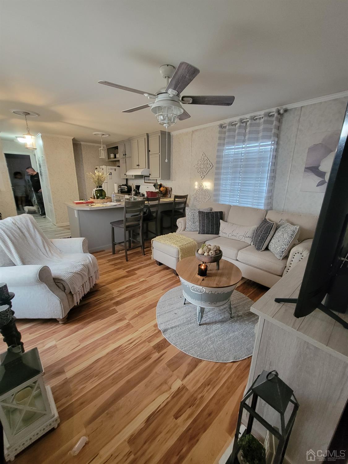 18 3rd Street Avenel, NJ 07001 - Photo 10 of 20 a living room with furniture and a wooden floor