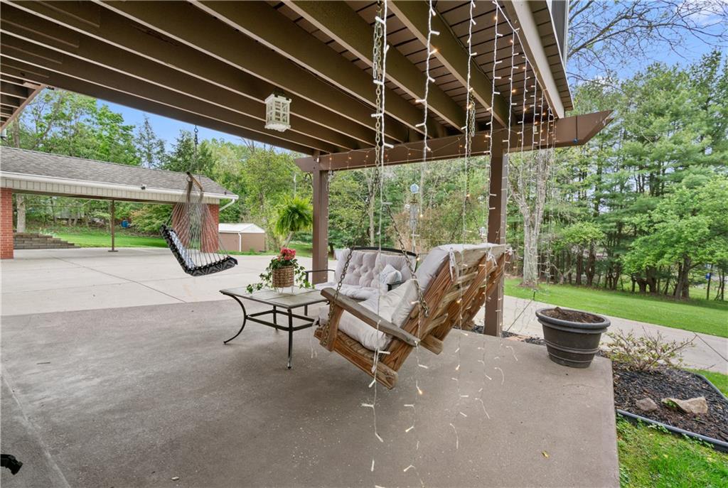 5431 Hamilton Road Gibsonia, PA 15044 - Photo 24 of 28 a view of a patio with table and chairs with a barbeque grill and plants