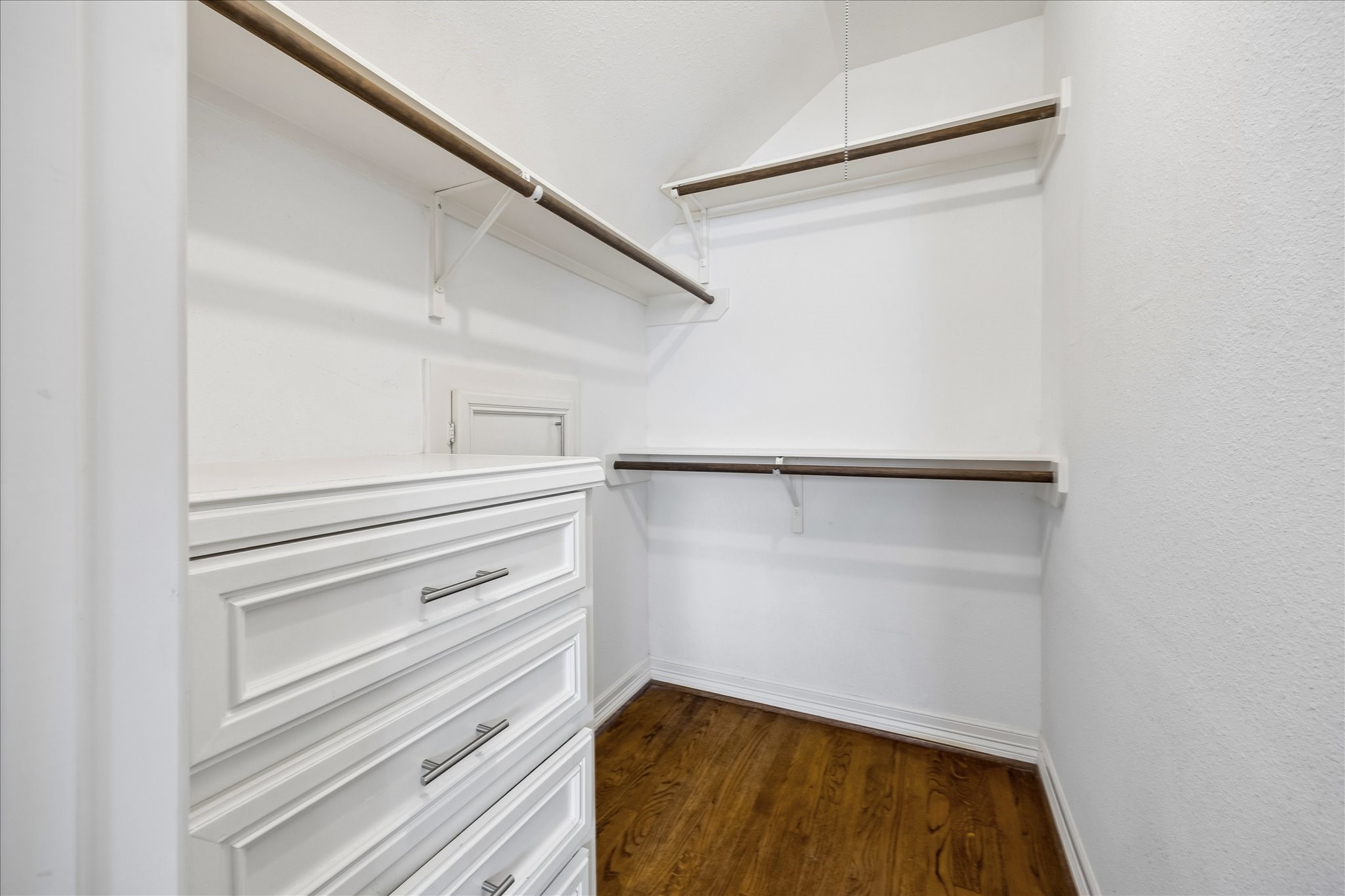 5019 Kinglet Street Houston, TX 77035 - Photo 16 of 24 Spacious primary closet with built-ins & hardwood floors!