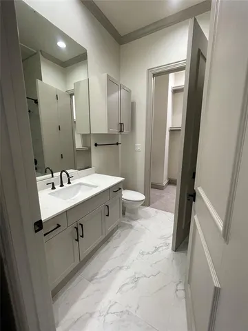 a bathroom with a double vanity sink mirror double and bathtub