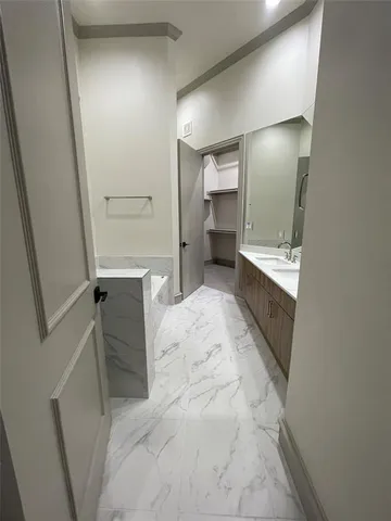 a bathroom with a sink and mirror