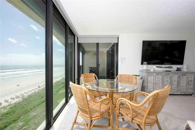 a view of balcony with furniture and wooden floor