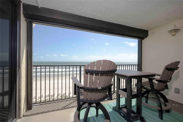 a large white bed in a white room