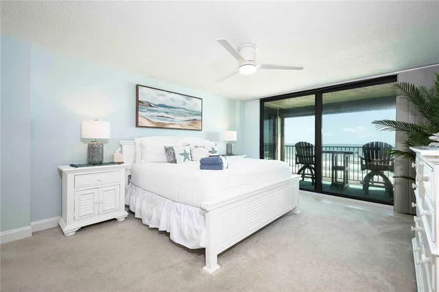 a large white bed in a white room