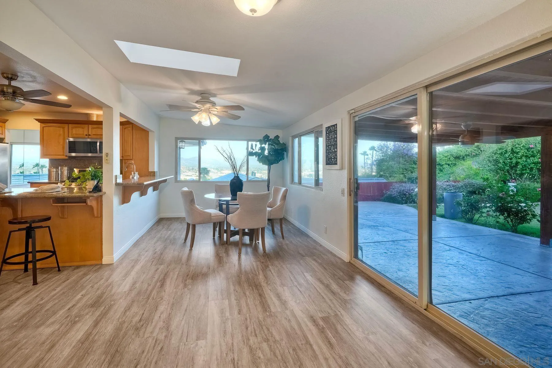 1605 Swallow Drive El Cajon, CA 92020 - Photo 12 of 39 a view of a dining room with furniture window and wooden floor