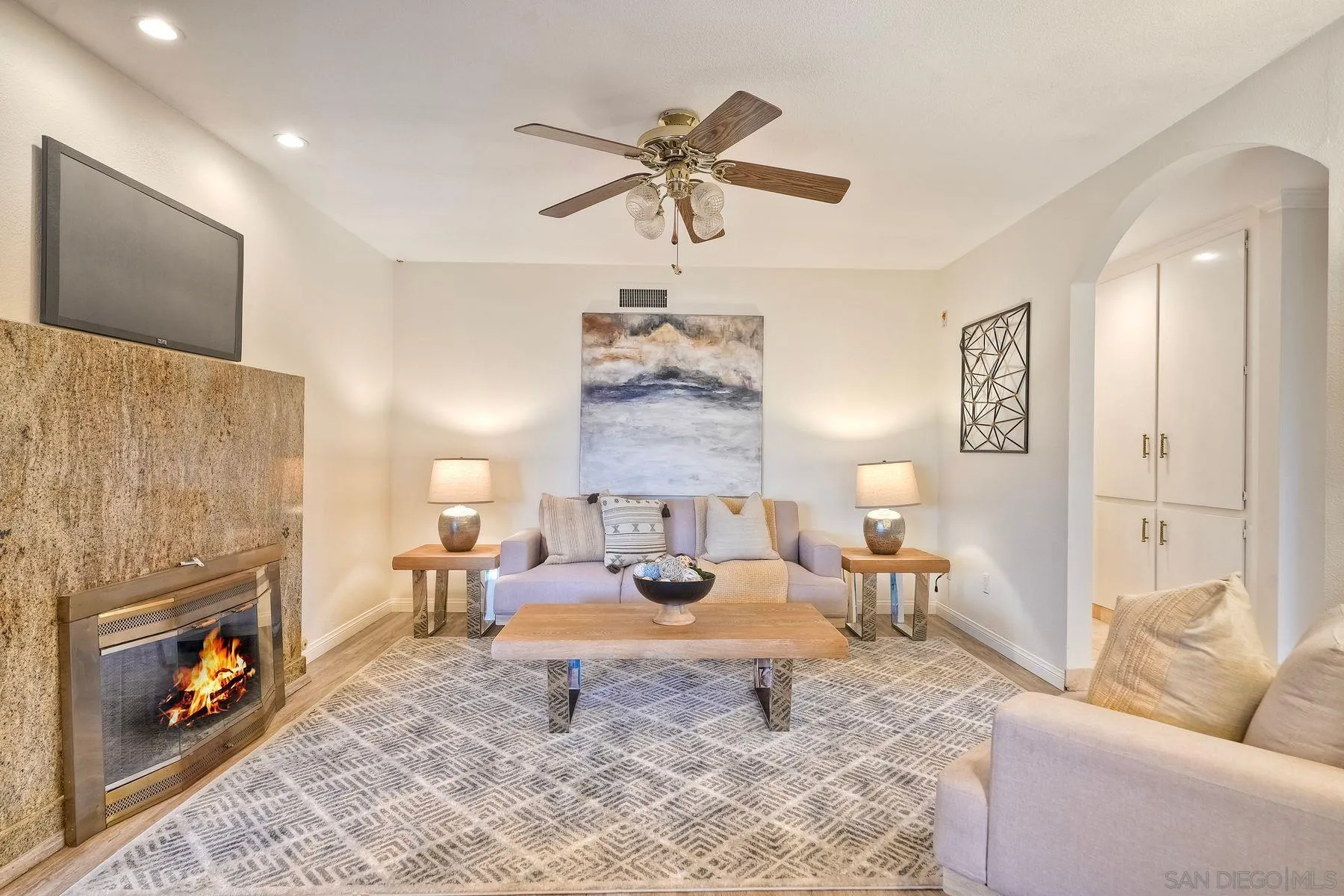 1605 Swallow Drive El Cajon, CA 92020 - Photo 16 of 39 a living room with furniture a fireplace and a chandelier