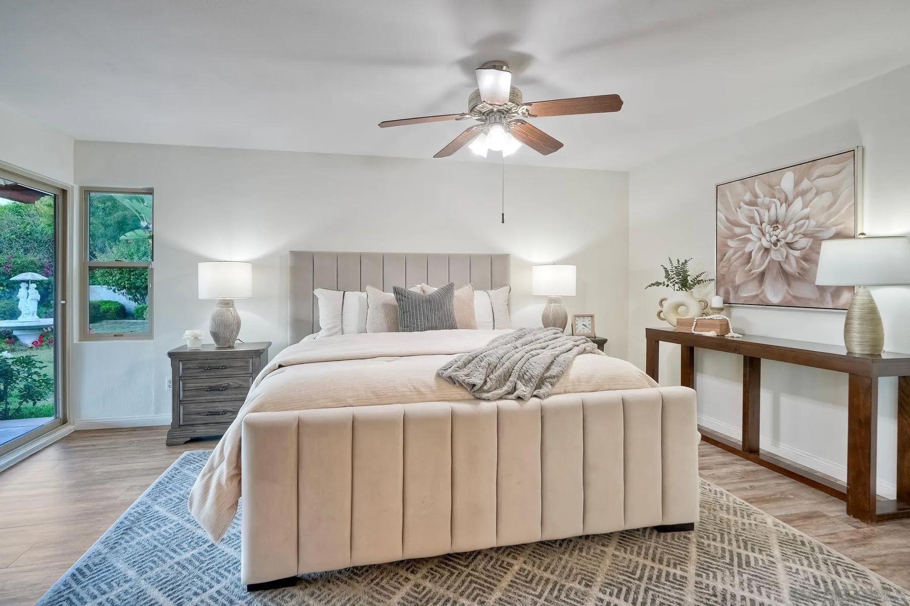 1605 Swallow Drive El Cajon, CA 92020 - Photo 18 of 39 a bedroom with a bed and a chandelier