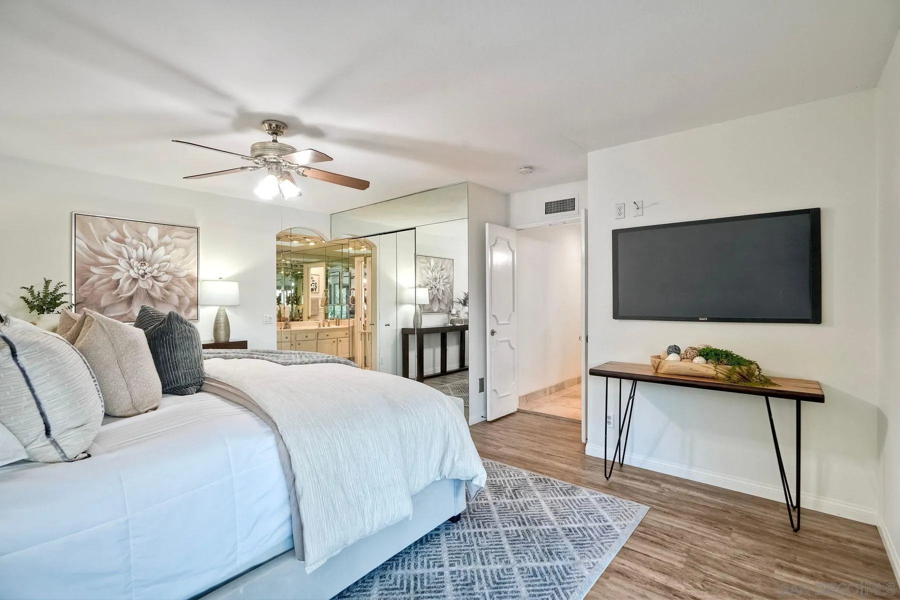 1605 Swallow Drive El Cajon, CA 92020 - Photo 20 of 39 a spacious bedroom with a bed and a flat screen tv