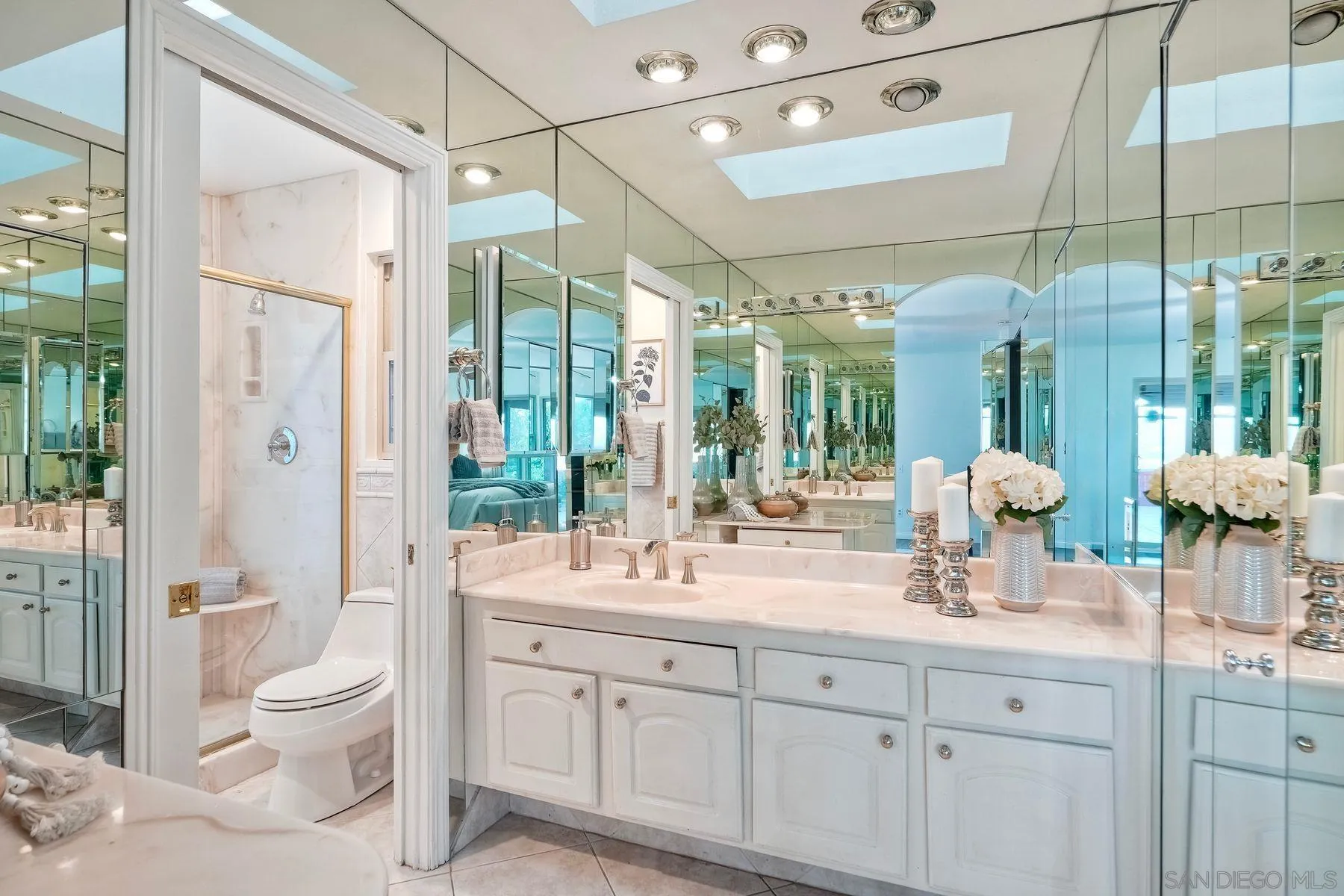 1605 Swallow Drive El Cajon, CA 92020 - Photo 23 of 39 a bathroom with a double vanity sink toilet and shower