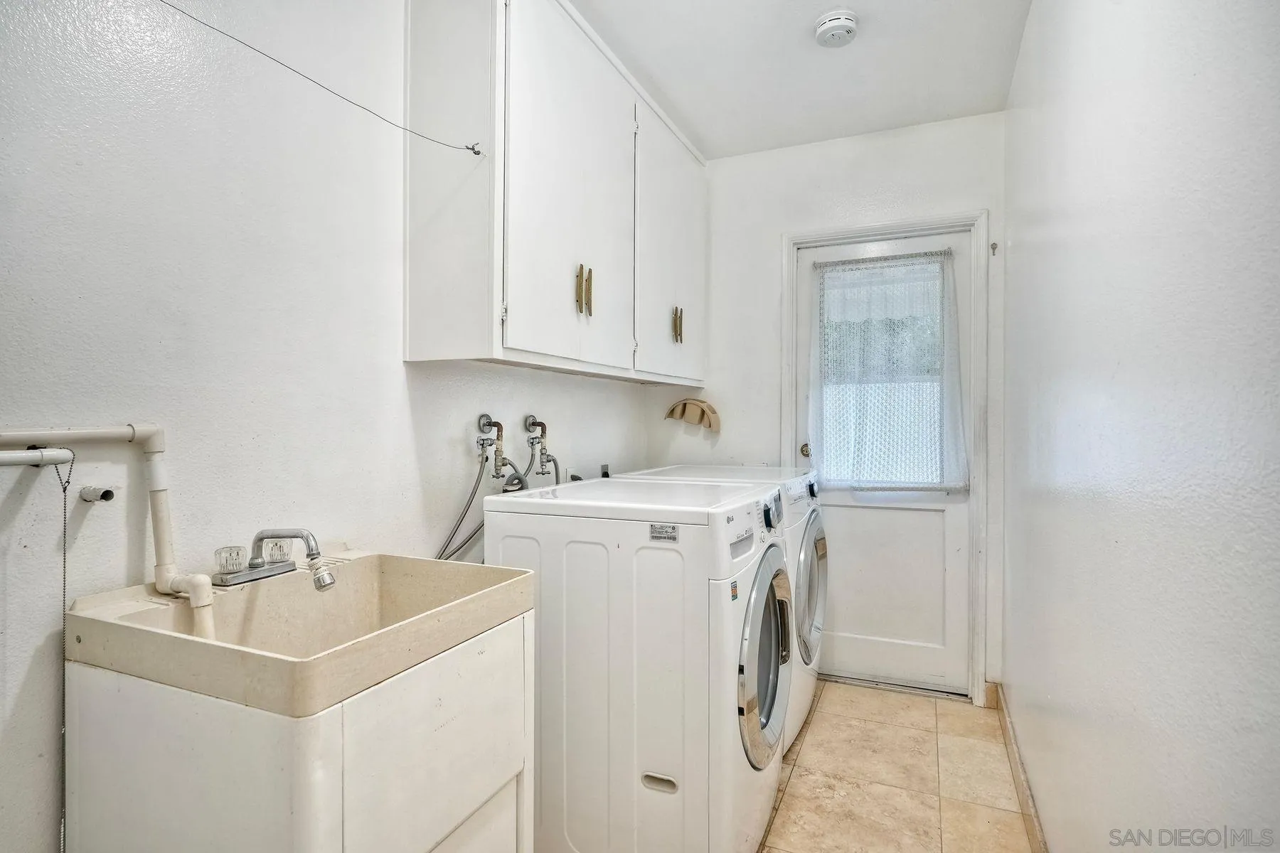 1605 Swallow Drive El Cajon, CA 92020 - Photo 24 of 39 a view of storage and utility room with washer and dryer